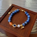 Detailed shot of fluorite crystal beaded bracelet with blue stones and gold hardware - 11# Blue Lotus Pod