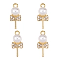 Macro detail of four gold lollipop pendants with white pearls and sparkling rhinestones - Lollipop Bowknot Pearl (px1086-35)
