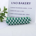 Green and white checkerboard knit pencil case with a zipper closure in a cylinder shape - Dark Green White Grid