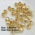 Detailed macro of 5.8x5mm gold-plated spacer beads with 2.5mm hole for DIY jewelry making - 20 (5.8mm Fine Texture Bead)