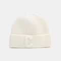 Detailed view of the soft ribbed knit texture and the C-letter patch on the white beanie - White