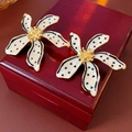 Macro shot of vintage flower earrings with black polka dots on a red wooden box - 42# Silver Earring Post - Gold
