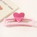 Detailed view of pink heart hair claw clip with smooth finish and rectangular hollow base - Heart Hollow Rectangle / Light Pink