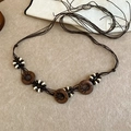 Detail of bohemian waist chain with wooden pendants and woven resin bead accents - 12# Round Wood Pendant Style (Coffee)