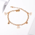 Detailed close-up of golden chain bracelet featuring three triangular cubic zirconia charms - Triangle Zirconia Gold