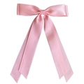 Close-up of a pink satin ribbon hair clip with long flowing tails on white background - Medium Pink