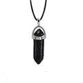 Macro shot of black hexagonal quartz point pendant with silver clasp on simple cord - Lava Stone + Leather Cord