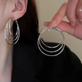Detailed view of silver triple hoop earrings with matte and polished metallic texture - 925 Silver Needle / Three-layer Metal Hoop Style / Silver