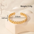 Adjustable wide gold stainless steel cuff bracelet with elegant leaf weave texture - Woven Texture