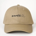 Close-up of black #momlife embroidery and heart on a khaki cotton baseball cap - One Size / Dark Khaki
