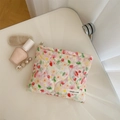 Detail of pink floral quilted makeup bag with simple wish label on cream surface - Pink Small Floral