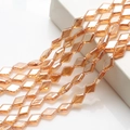 Macro view of amber diamond-cut glass crystal beads with electroplated luster - Amber Gold