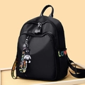 Schwarzer Oxford Rucksack mit bunten LOVE-Gurten und süßem Teddybär-Anhänger - Standardgröße / Schwarz / Mit Bärenanhänger