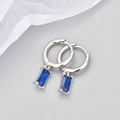 Macro shot of S925 sterling silver hoop earrings with rectangular blue zircon charms - Copper / Platinum Blue Zirconia