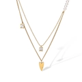 Close-up of double-layered gold necklace with heart pendant, pearls and square zircon detail - Layered Pearl Heart Style (23513)