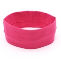 Detailed close-up of rose red knitted elastic yoga headband with soft cotton texture - Magenta