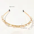 Close-up of golden double chain headband with black protective rubber tips and polished finish - Metal Headband-Interlocked Chain