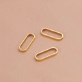 Trois connecteurs ovales dorés pour la création de bijoux DIY sur tissu rose - Doré