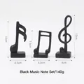 Three-piece matte black musical note statues for desktop decor with size dimensions - Black