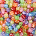 Close-up of colorful acrylic square alphabet beads for DIY kids jewelry making - 6x6mm Transparent Colored Letters (100pcs)