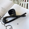 Close-up of glossy black resin shark hair claw clip with a minimalist twisted design - Butterfly Buckle Ribbon (Approx 12cm) / Glossy Black