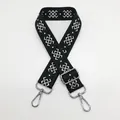 Close-up of ethnic jacquard canvas strap with geometric pattern and silver metal clasps - Black Green Silver Hook