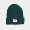 Close-up of thick rib-knit texture and white AQER fabric label on dark green beanie - Dark Green
