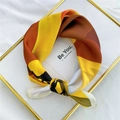 Elegant yellow and orange geometric silk scarf displayed on a golden decorative tray - 53cm / 20 Desert Camel