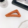 Triangle matte hair claw clip in brick red finish with a minimalist hollow design - Orange