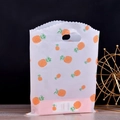Translucent white plastic gift bag with orange pineapple pattern and scalloped edges - 15x20cm / Small Pineapple