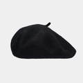 Detailed view of black wool beret showing thick fabric texture and classic top stem - Black