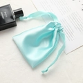 Light blue satin drawstring gift pouch with smooth finish and matching ribbon closure - Fresh Green