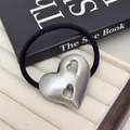 Minimalist silver heart metal hair tie with hollow design on black elastic cord - Double Hollow Heart / Silver