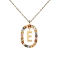 Detailed close-up of a gold-toned necklace with colorful zircon letter E pendant - Letter E