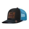 Mesh trucker hat in black and blue with a debossed brown leather patch decoration - Black+Blue