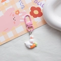 Close-up of pink carrot bunny keychain with white resin rabbit and orange carrot charm - White Carrot Rabbit