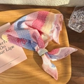 Close-up of floral cotton linen headscarf with star patterns on a wooden tray - Rainbow Stripe (25218C)