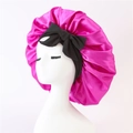 Rose red satin sleep bonnet with black bow decoration on white mannequin head - Medium Single Layer Black Cross Ribbon / Rose Red