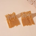 Detail of gold fringe earrings with zircon stones on a decorative stone background - Cross Tassel Studs (WE1630) / Gold