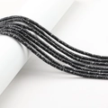 Strands of black cylinder heishi beads with white spots for DIY jewelry making - Snowflake Obsidian
