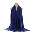 Detailed view of the soft navy blue cashmere-feel scarf with elegant fringe trim on a mannequin - Sapphire Blue