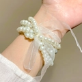 Elegant multi-layer pearl bracelet featuring a sheer white organza ribbon bow decoration - White Bowknot Pearl Style (10892)