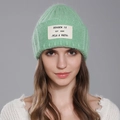 Mint green knit rabbit fur beanie featuring a white lettered patch for a stylish winter look - Light Green