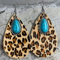 Detailed shot of leopard print cowhide teardrop earrings with turquoise stones and silver hooks - Leopard Print Fur