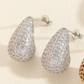 Macro shot of silver teardrop earrings with micro-paved sparkling cubic zirconia stones - Silver White Zirconia
