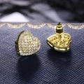 Elegant gold heart stud earrings with white micro-pave cubic zirconia on blue jewelry box - Gold