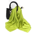 Close-up of a glossy bright green silk-like satin scarf tied on a leather handbag - One Size / Faux Silk Satin / Bright Green