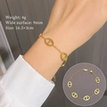 Minimalist gold titanium steel chain bracelet with interlocking pig nose links on wrist - Titanium Steel / Gold