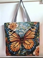 Spacious woven tote bag featuring a vibrant monarch butterfly and sunflower design - Butterfly