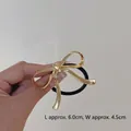 Minimalist golden metal bow hair tie with black high-elastic rope, size 6.0cm x 4.5cm - Ribbon Bow Gold